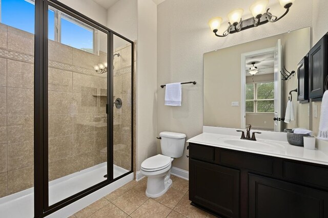 204 Lake Como Dr, Austin, TX 78734 - bathroom with a stall shower, vanity, tile patterned flooring, and ceiling fan