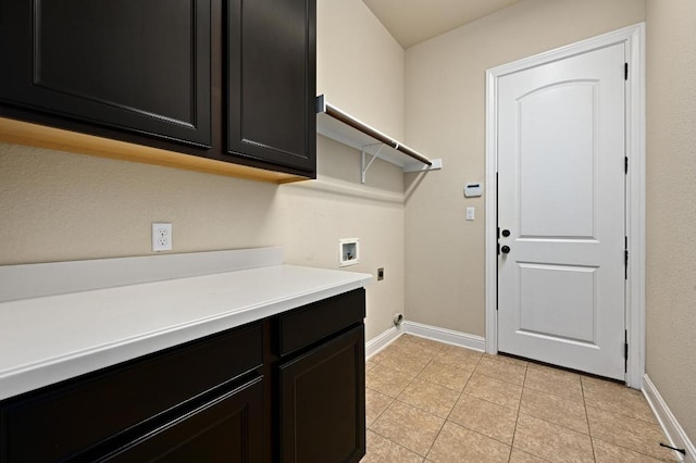 204 Lake Como Dr, Austin, TX 78734 - laundry area with washer hookup, electric dryer hookup, cabinet space, and light tile patterned flooring