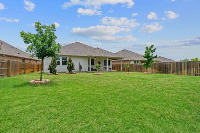 4409 Arques Ave, Round Rock, TX 78681 - back of house featuring a ceiling fan, a fenced backyard, and a patio area