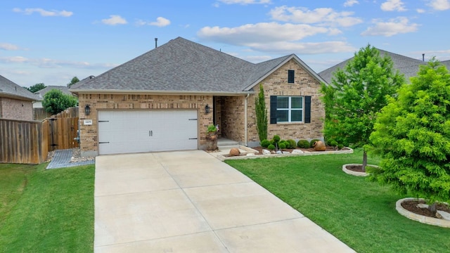 4409 Arques Ave, Round Rock, TX 78681 - view of front of house featuring an attached garage, brick siding, roof with shingles, and concrete driveway