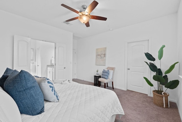 4409 Arques Ave, Round Rock, TX 78681 - bedroom with carpet flooring, ceiling fan, and connected bathroom