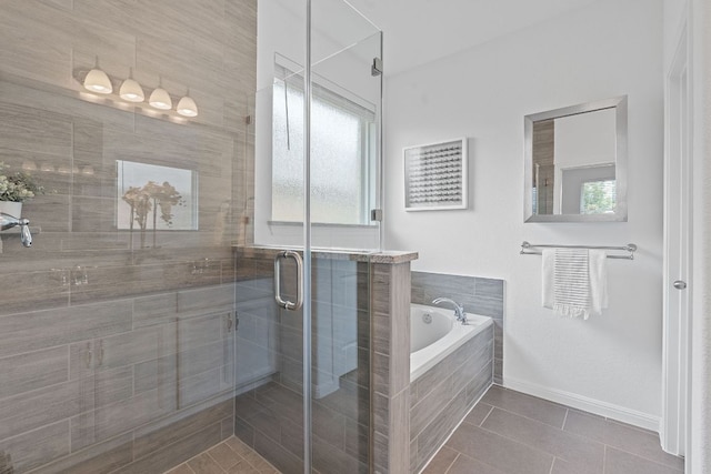 4409 Arques Ave, Round Rock, TX 78681 - bathroom with a garden tub, tile patterned flooring, and a shower stall