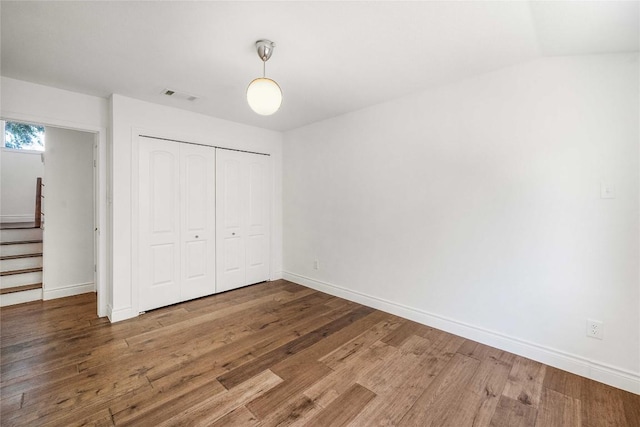 10703 Keystone Bnd, Austin, TX 78750 - unfurnished bedroom with wood finished floors and a closet