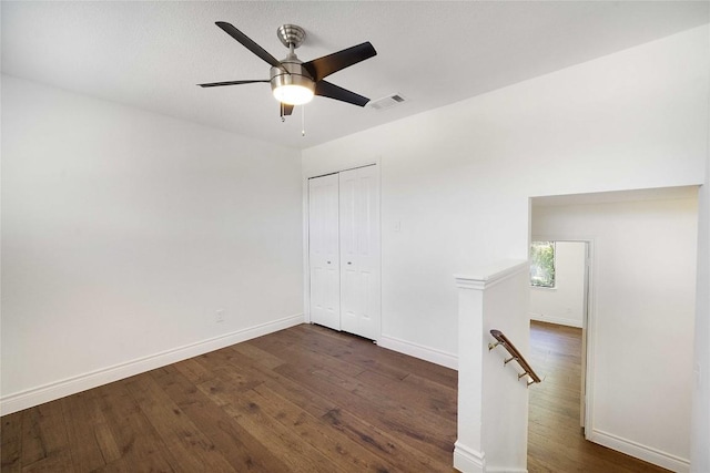 10703 Keystone Bnd, Austin, TX 78750 - unfurnished bedroom with dark wood finished floors, a closet, and a ceiling fan