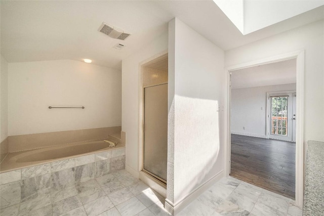 10703 Keystone Bnd, Austin, TX 78750 - full bathroom featuring a bath, a shower stall, and marble finish flooring