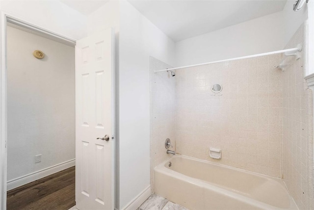 10703 Keystone Bnd, Austin, TX 78750 - bathroom with shower / tub combination and wood finished floors