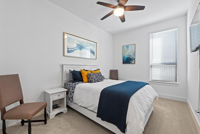 bedroom with light carpet and ceiling fan