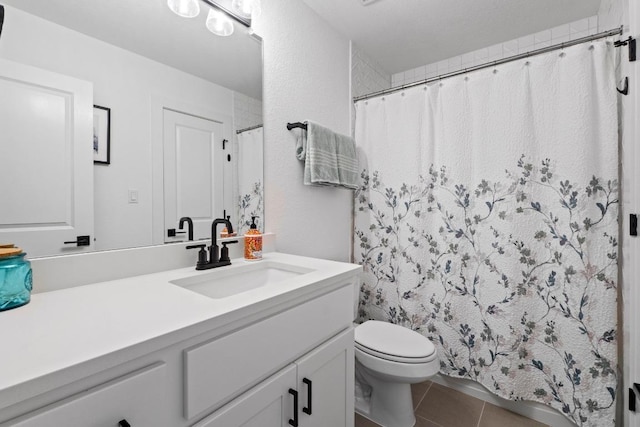 full bathroom featuring vanity, tile patterned floors, and a shower with curtain