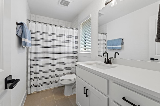 full bathroom featuring vanity, a shower with shower curtain, and tile patterned flooring