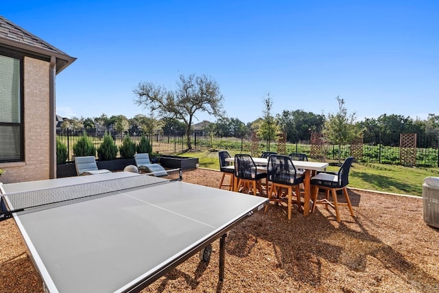 view of patio featuring outdoor dining area