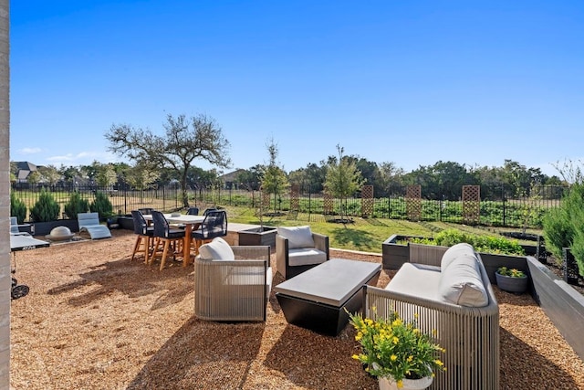 view of patio with an outdoor living space and outdoor dining area