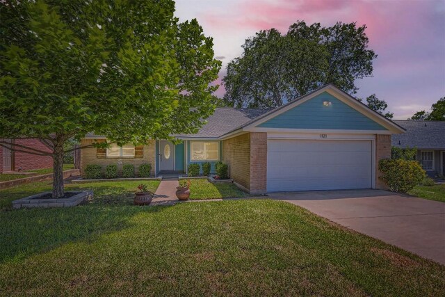 1121 Stoneoak Ln, Austin, TX 78745 - ranch-style house featuring a garage, concrete driveway, a front lawn, and brick siding