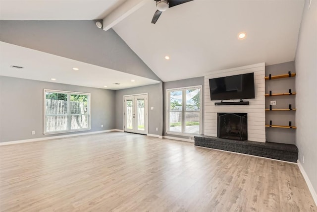 1121 Stoneoak Ln, Austin, TX 78745 - unfurnished living room featuring wood finished floors, a fireplace, ceiling fan, beamed ceiling, and recessed lighting