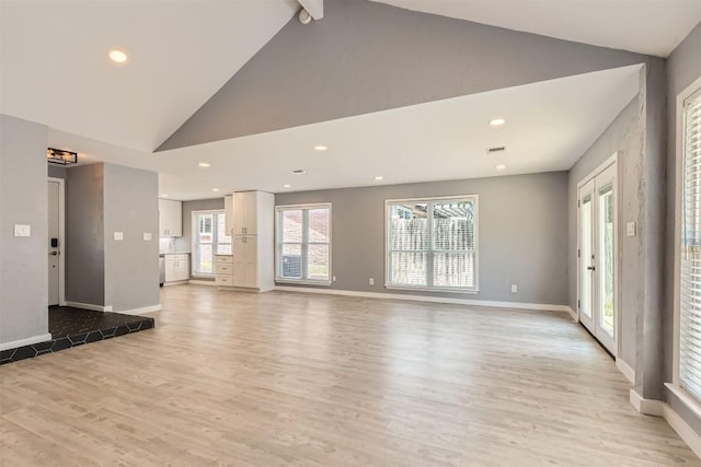 1121 Stoneoak Ln, Austin, TX 78745 - unfurnished living room featuring light wood-style flooring, recessed lighting, and high vaulted ceiling
