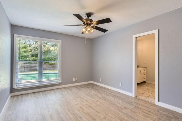 1121 Stoneoak Ln, Austin, TX 78745 - spare room featuring light wood-type flooring and ceiling fan