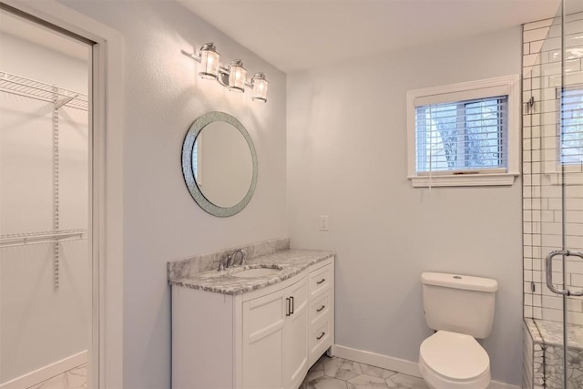 1121 Stoneoak Ln, Austin, TX 78745 - full bath with marble look tiles, vanity, a spacious closet, and an enclosed shower