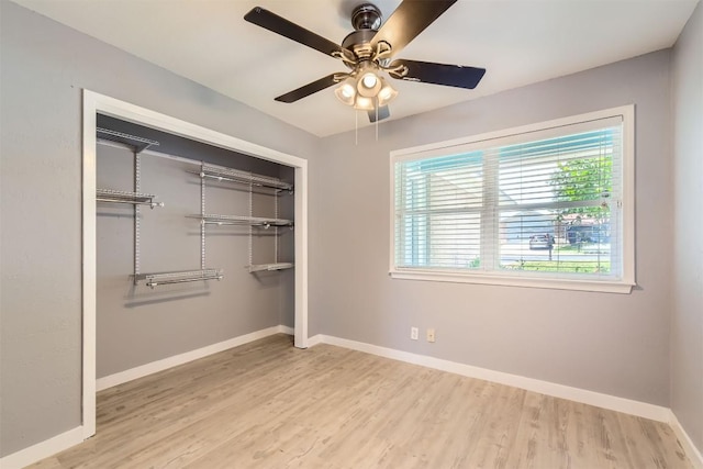 1121 Stoneoak Ln, Austin, TX 78745 - unfurnished bedroom featuring wood finished floors, a closet, and ceiling fan