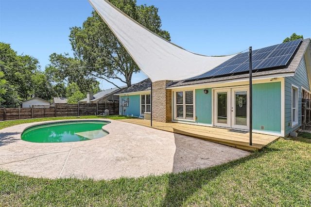 1121 Stoneoak Ln, Austin, TX 78745 - view of swimming pool featuring french doors, a wooden deck, and a fenced backyard