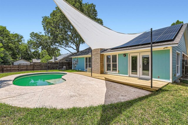 1121 Stoneoak Ln, Austin, TX 78745 - view of swimming pool featuring french doors, a wooden deck, and a fenced backyard