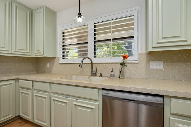 6317 Gato Path, Austin, TX 78731 - kitchen with stainless steel dishwasher, light countertops, backsplash, and pendant lighting