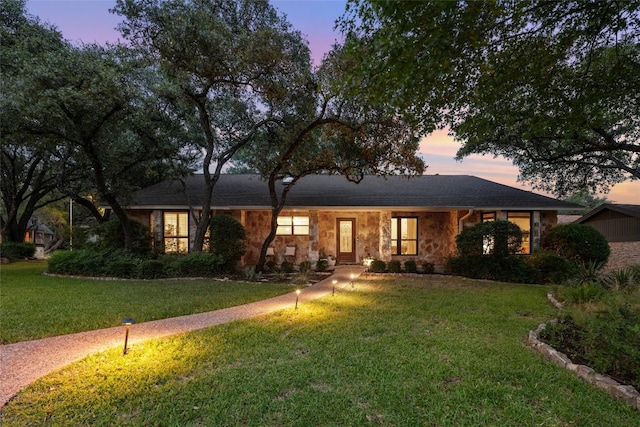 6317 Gato Path, Austin, TX 78731 - ranch-style home with a front yard and stone siding