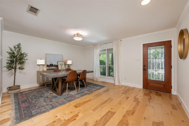 6317 Gato Path, Austin, TX 78731 - dining room with light wood-style floors and ornamental molding