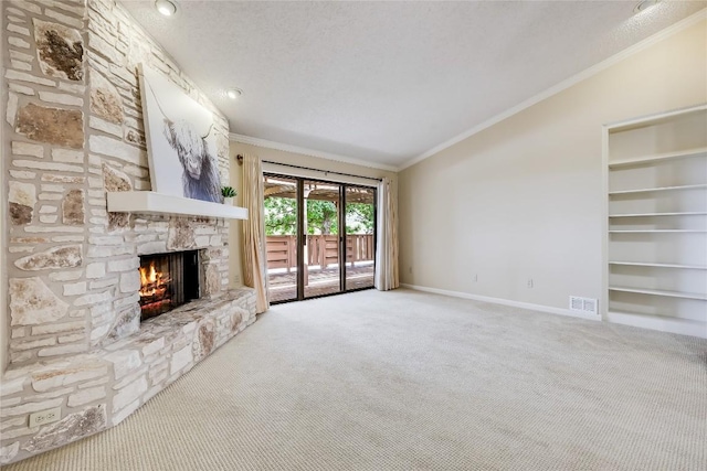 45 Oaks Pl, Lago Vista, TX 78645 - unfurnished living room with carpet flooring, a fireplace, ornamental molding, vaulted ceiling, and a textured ceiling