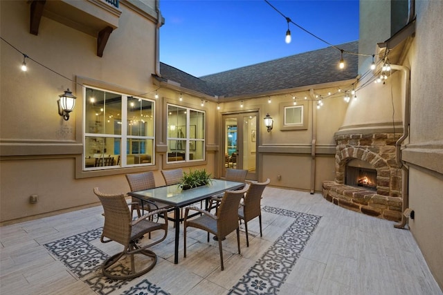 6000 Osceola Trl, Austin, TX 78738 - view of patio featuring an outdoor stone fireplace and outdoor dining space