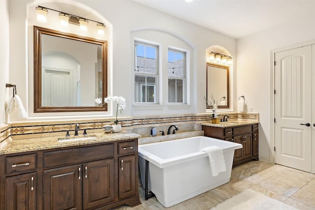 6000 Osceola Trl, Austin, TX 78738 - bathroom featuring two vanities and a soaking tub