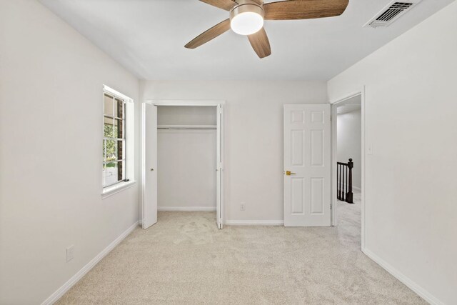 4217 Greystone Dr N, Austin, TX 78731 - unfurnished bedroom with carpet floors, a closet, and ceiling fan