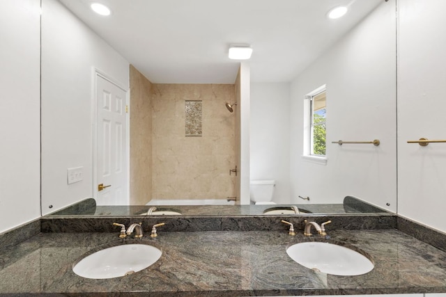 4217 Greystone Dr N, Austin, TX 78731 - bathroom featuring double vanity, a shower, and recessed lighting