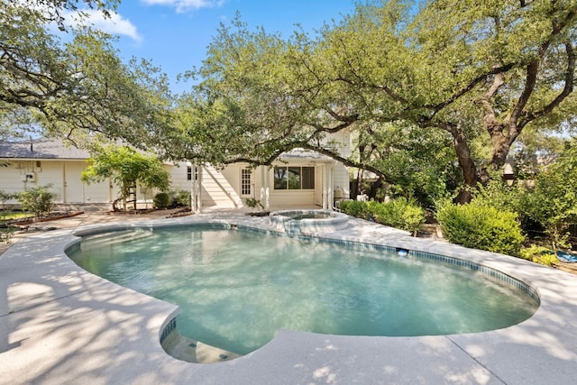 4217 Greystone Dr N, Austin, TX 78731 - view of swimming pool featuring a pool with connected hot tub