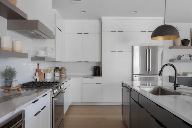 7809 Old Bee Caves Rd Unit 12, Austin, TX 78735 - kitchen featuring stainless steel appliances, wall chimney range hood, open shelves, modern cabinets, and recessed lighting