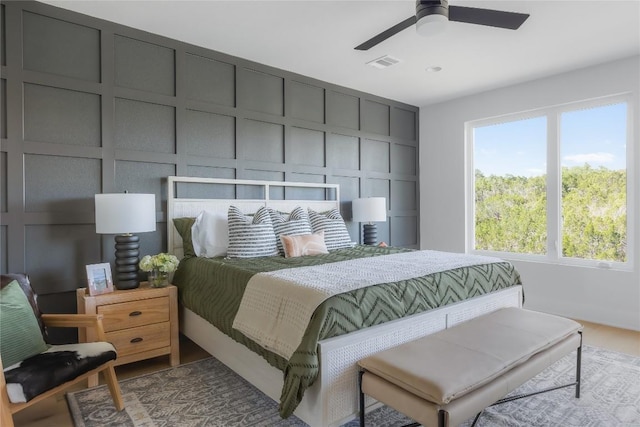 7809 Old Bee Caves Rd Unit 12, Austin, TX 78735 - bedroom with a decorative wall and a ceiling fan