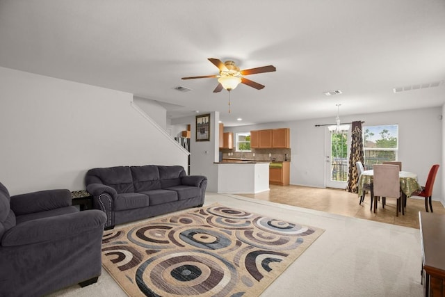 11104 Helms Deep Dr, Austin, TX 78754 - living area featuring ceiling fan and stairs