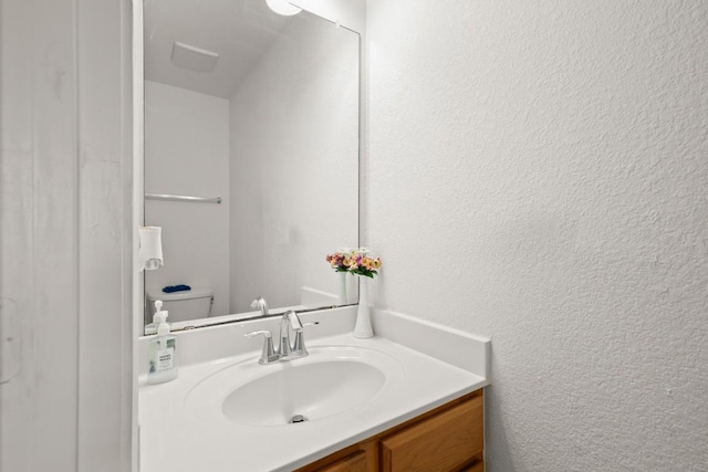 11104 Helms Deep Dr, Austin, TX 78754 - bathroom with vanity and a textured wall