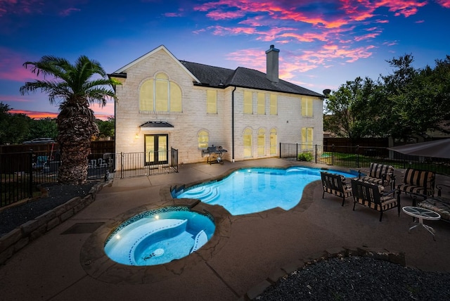 11606 Uplands Ridge Dr, Bee Cave, TX 78738 - view of swimming pool featuring french doors, an in-ground hot tub, a patio area, and a fenced backyard