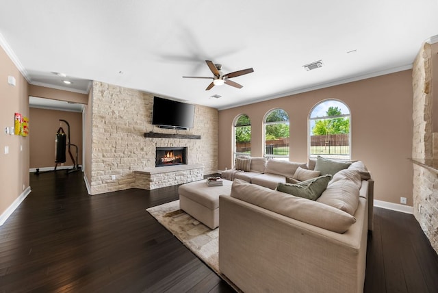 11606 Uplands Ridge Dr, Bee Cave, TX 78738 - living area featuring crown molding, ceiling fan, a fireplace, and dark wood-type flooring
