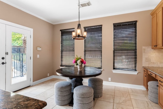 11606 Uplands Ridge Dr, Bee Cave, TX 78738 - dining space featuring crown molding, a chandelier, and light marble finish floors