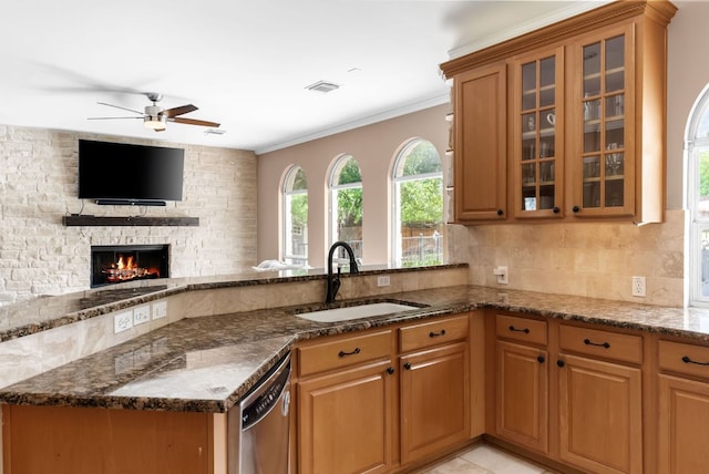 11606 Uplands Ridge Dr, Bee Cave, TX 78738 - kitchen featuring dishwasher, dark stone countertops, a ceiling fan, open floor plan, and decorative backsplash