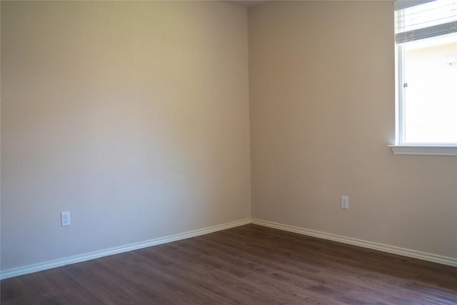214 Wild Plum, San Marcos, TX 78666 - unfurnished room featuring dark wood finished floors and baseboards