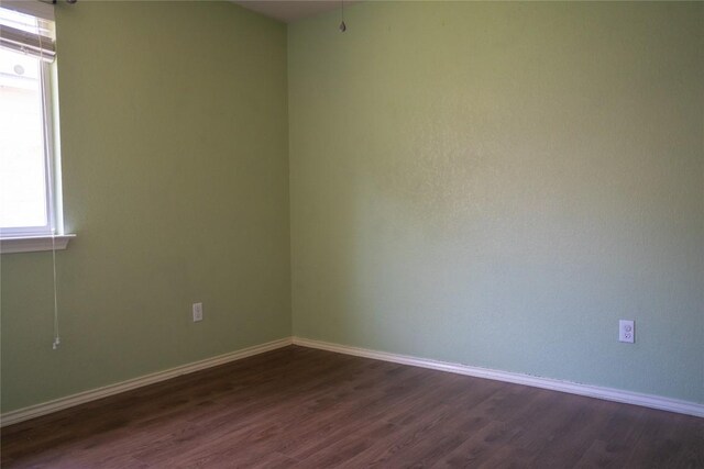 214 Wild Plum, San Marcos, TX 78666 - spare room featuring dark wood-style floors and baseboards