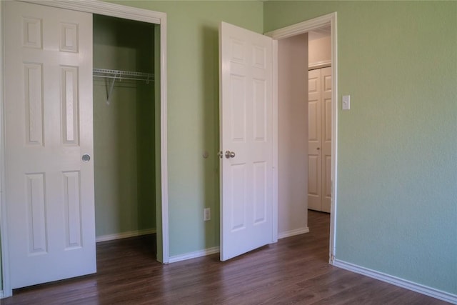 214 Wild Plum, San Marcos, TX 78666 - unfurnished bedroom featuring dark wood finished floors and a closet