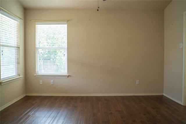214 Wild Plum, San Marcos, TX 78666 - spare room with dark wood-type flooring and ceiling fan