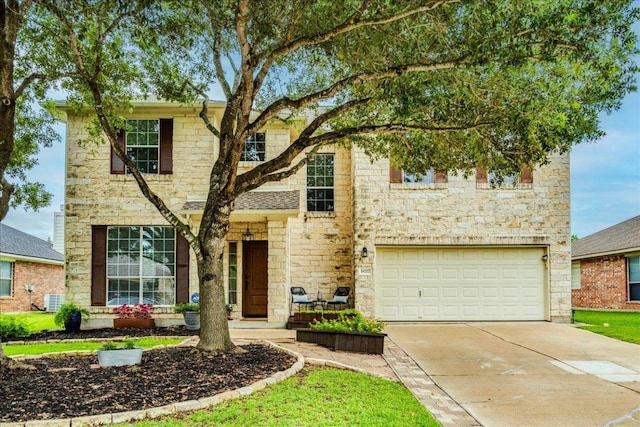18717 Shoreless Dr, Pflugerville, TX 78660 - traditional home with stone siding, driveway, and a garage