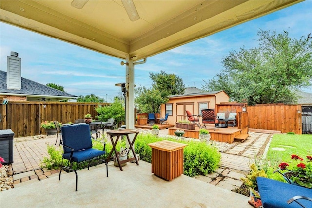 18717 Shoreless Dr, Pflugerville, TX 78660 - fenced backyard with outdoor dining space, a ceiling fan, an outbuilding, an outdoor living space, and a patio area