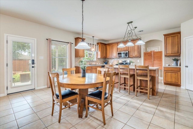 18717 Shoreless Dr, Pflugerville, TX 78660 - dining area featuring light tile patterned floors and baseboards