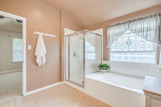 18717 Shoreless Dr, Pflugerville, TX 78660 - full bathroom featuring a bath, a shower stall, lofted ceiling, and tile patterned floors