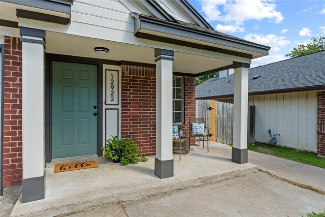 12922 Staton Dr, Austin, TX 78727 - view of exterior entry featuring brick siding and covered porch