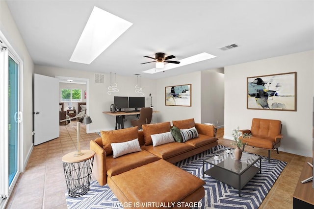 12922 Staton Dr, Austin, TX 78727 - living area with a skylight, tile patterned floors, ceiling fan, and a desk